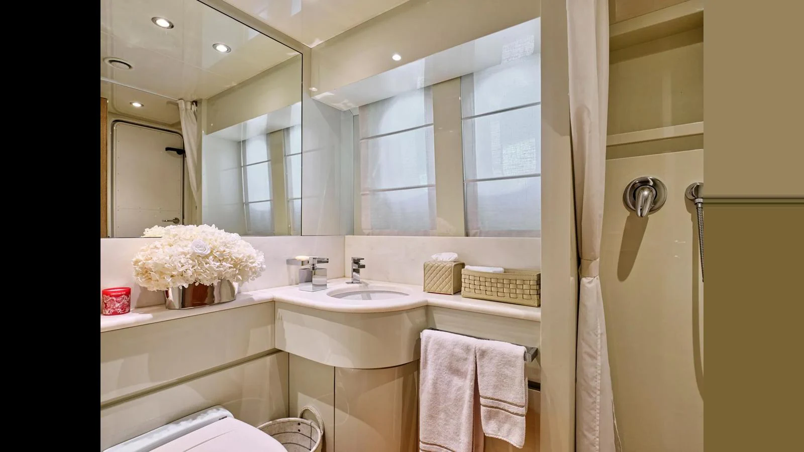A well-appointed yacht bathroom featuring modern fixtures and elegant decor. aboard THEOLINA Yacht for Sale