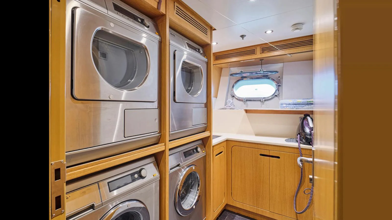 The yacht's laundry room is equipped with modern appliances and ample storage space. aboard THEOLINA Yacht for Sale