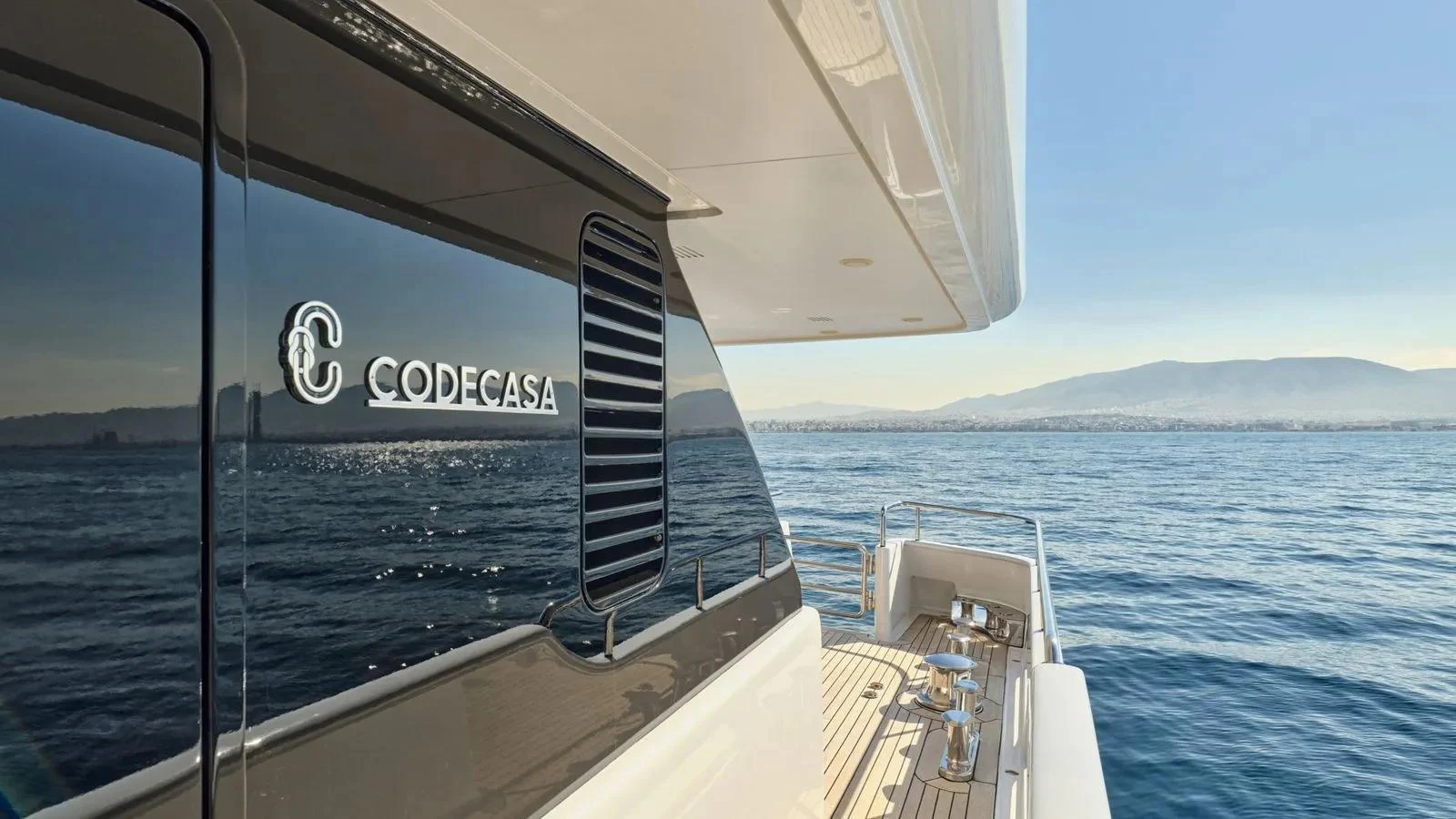 The yacht cruises smoothly on the water, showcasing its sleek exterior design and luxurious deck space. aboard THEOLINA Yacht for Sale