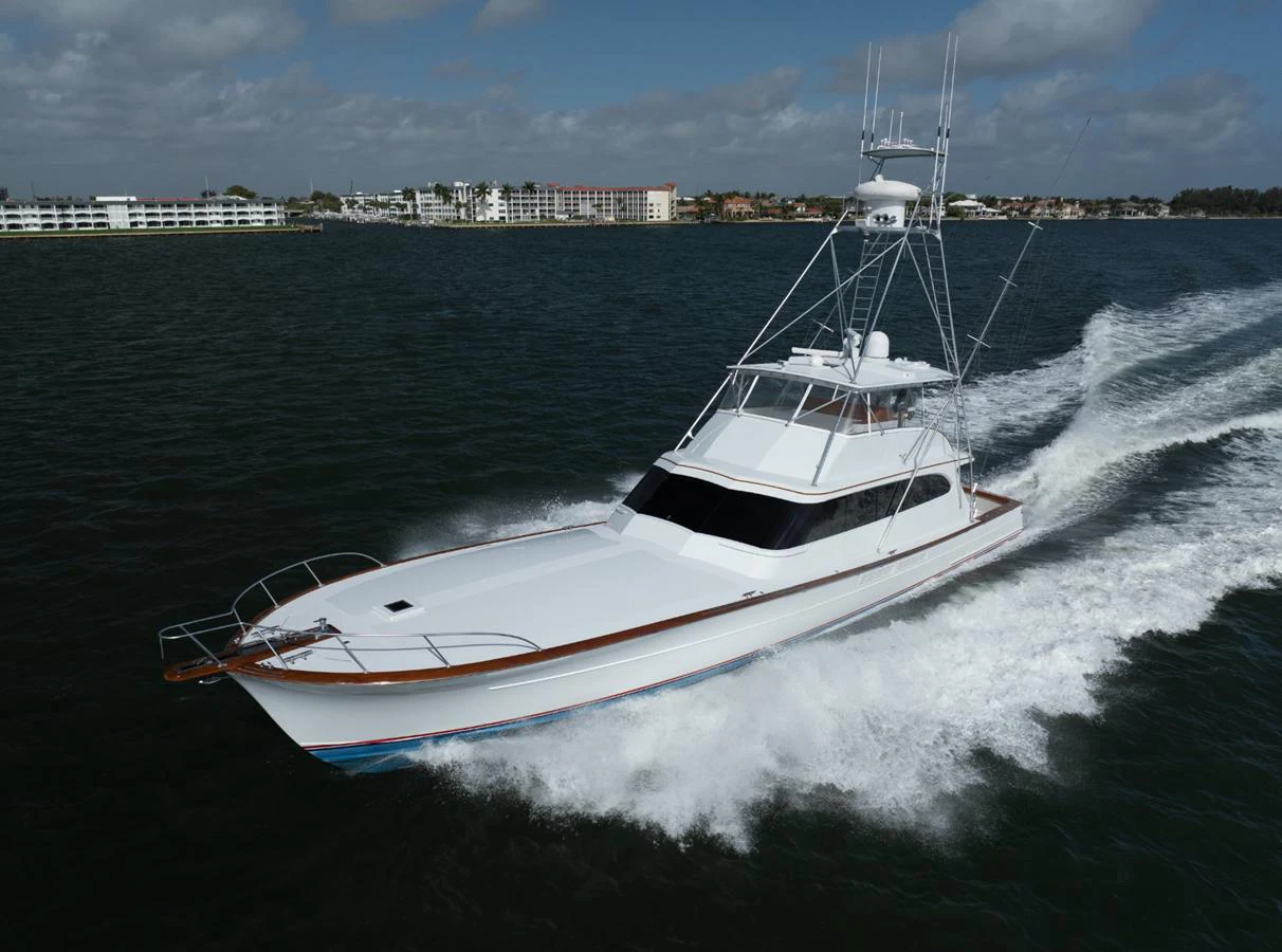A sleek yacht cruises swiftly through the water, showcasing its elegant design and powerful performance. aboard WISH YOU WERE HERE Yacht for Sale