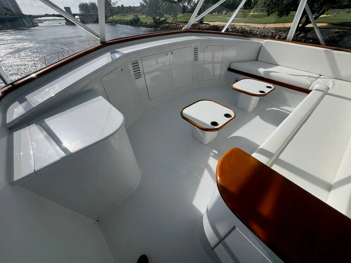 The flybridge offers a spacious seating area with a sleek, modern design and beautiful views. aboard WISH YOU WERE HERE Yacht for Sale