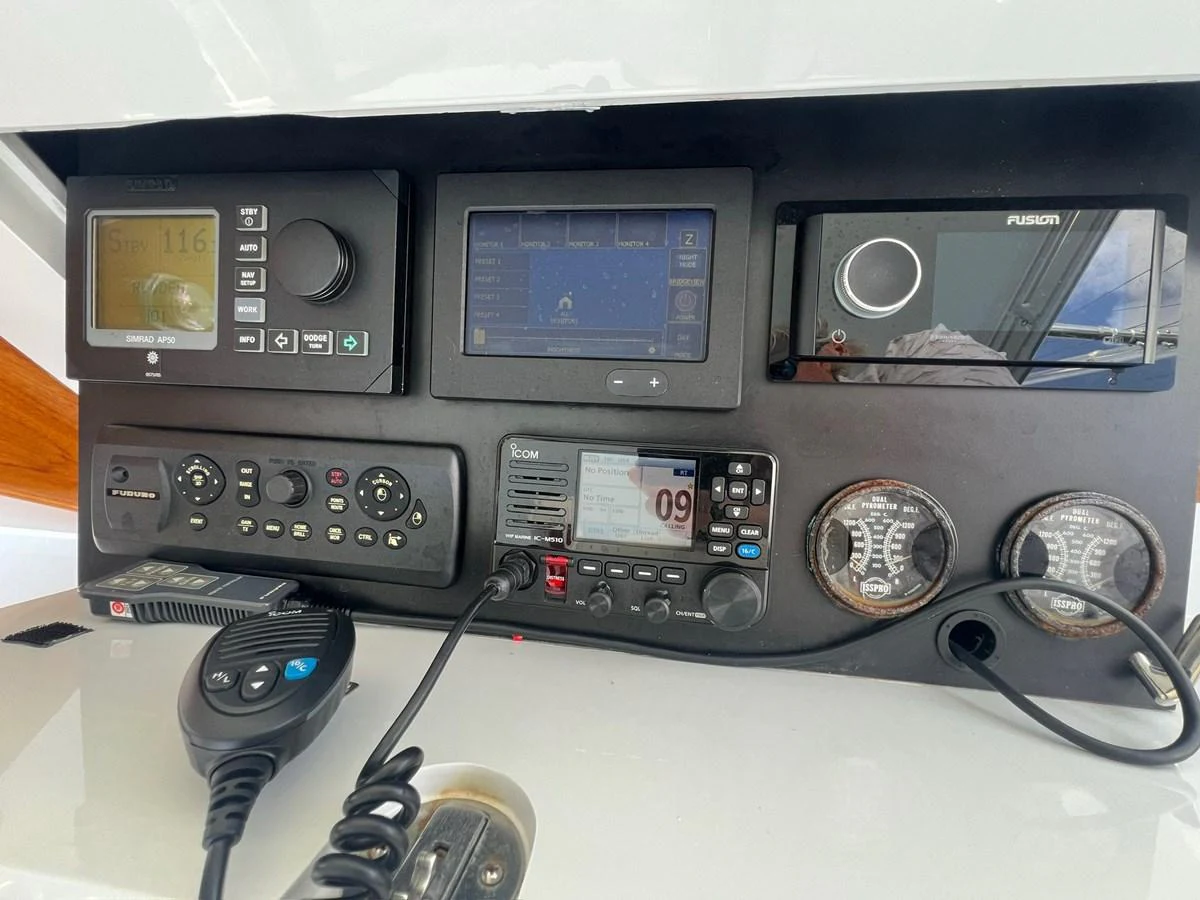 The helm station features advanced navigation and communication equipment for a seamless sailing experience. aboard WISH YOU WERE HERE Yacht for Sale