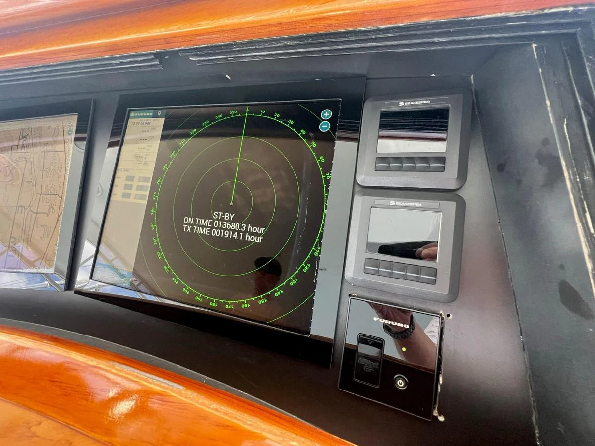 The helm features advanced navigation and control systems for precise yacht management. aboard WISH YOU WERE HERE Yacht for Sale