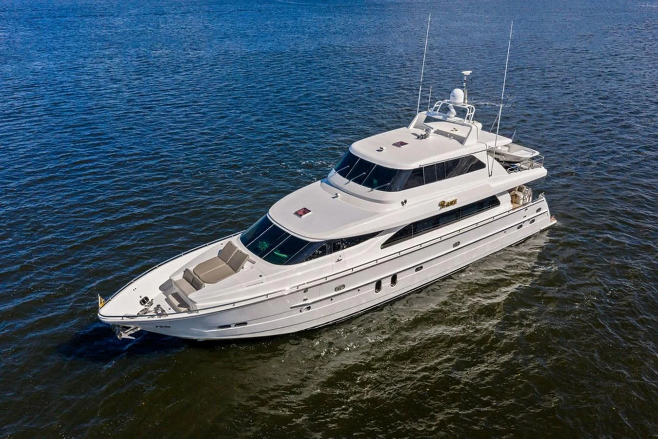A sleek and elegant yacht glides gracefully on calm waters, showcasing its luxurious design and spacious decks. aboard BABE Yacht for Sale