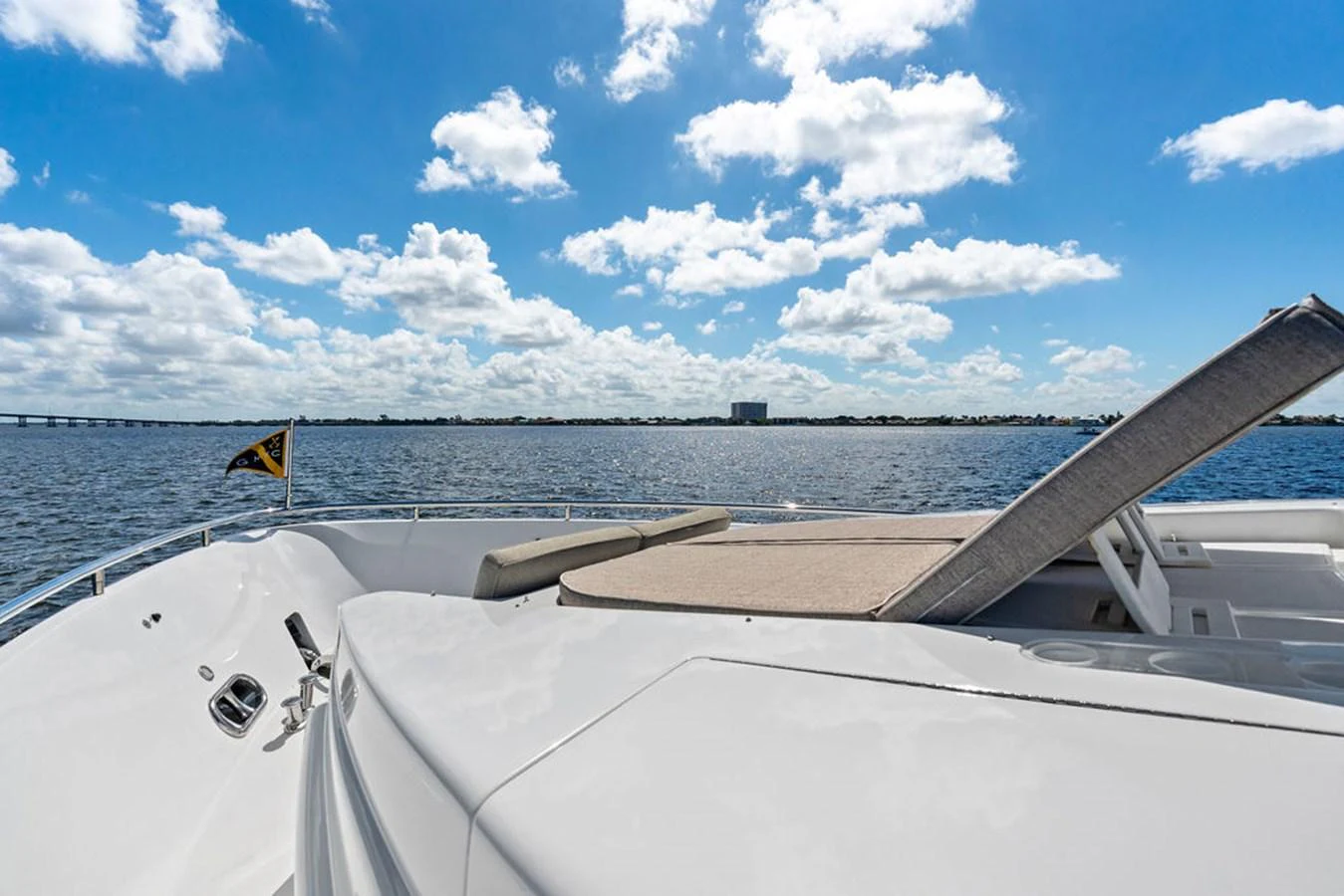 The foredeck features a sunpad with a stunning view of the open water and sky. aboard BABE Yacht for Sale