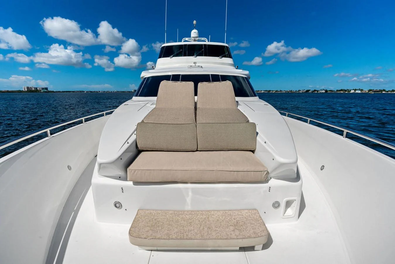 The foredeck features a spacious sunpad with plush cushions, perfect for relaxation while cruising. aboard BABE Yacht for Sale