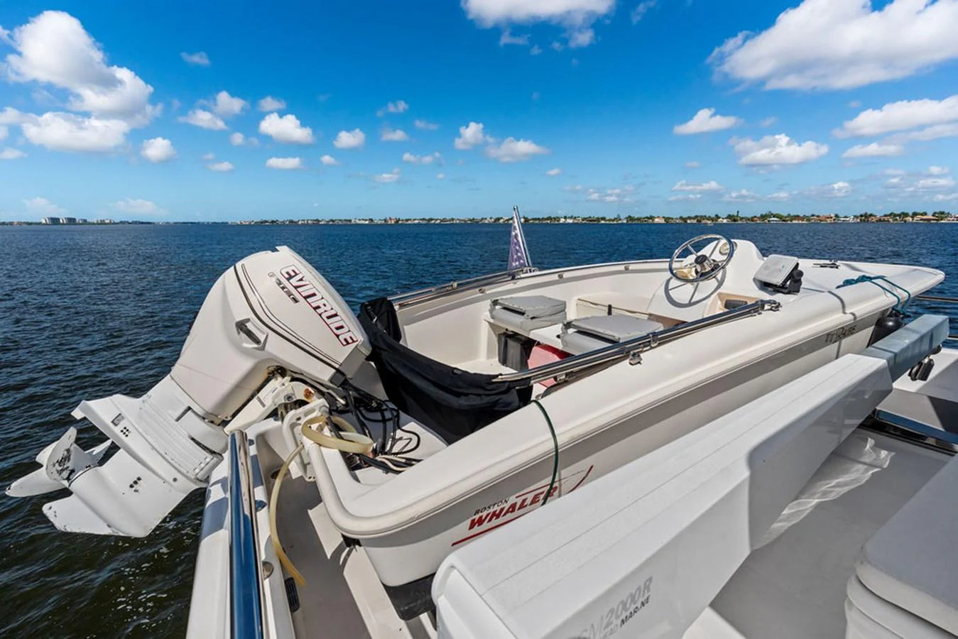 A sleek tender boat is secured on the deck, ready for excursions. aboard BABE Yacht for Sale