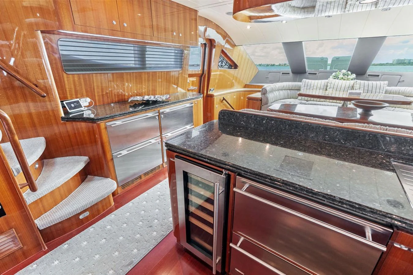The yacht's galley features sleek countertops, modern appliances, and elegant wood finishes. aboard BABE Yacht for Sale