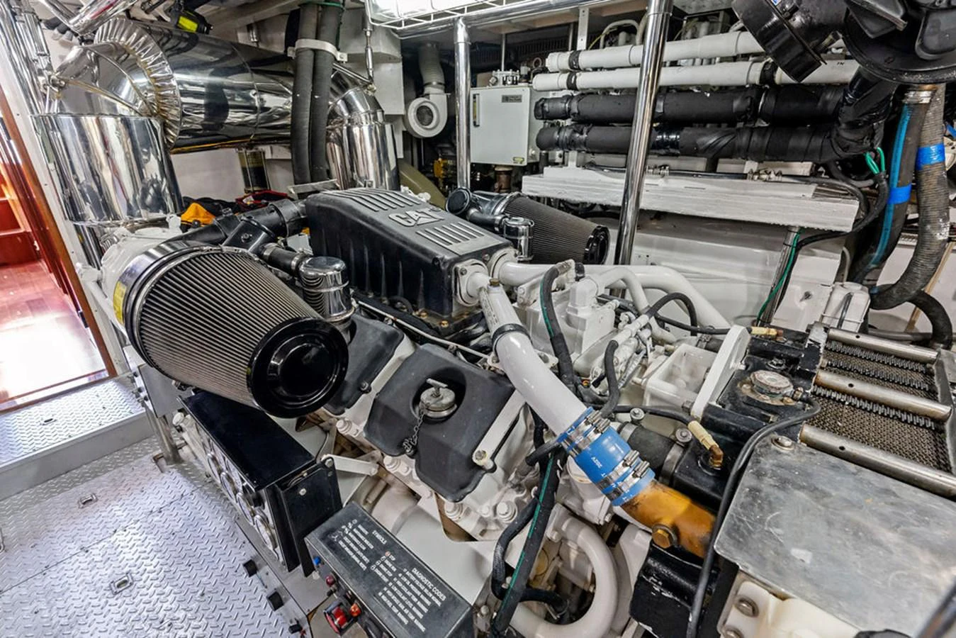 A meticulously maintained engine room showcasing powerful machinery and advanced engineering. aboard BABE Yacht for Sale