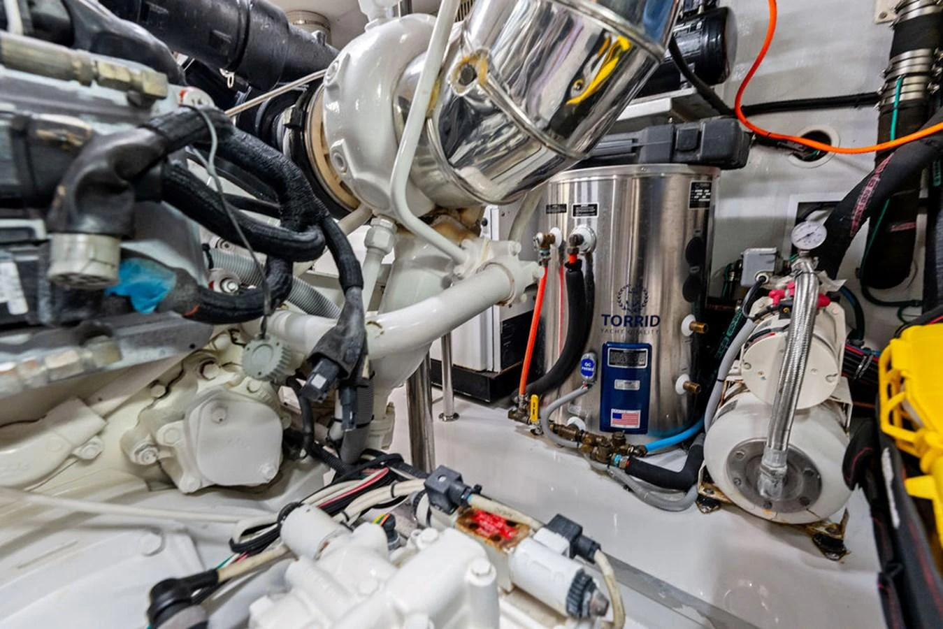The image showcases the intricate and well-maintained engine room of the yacht. aboard BABE Yacht for Sale