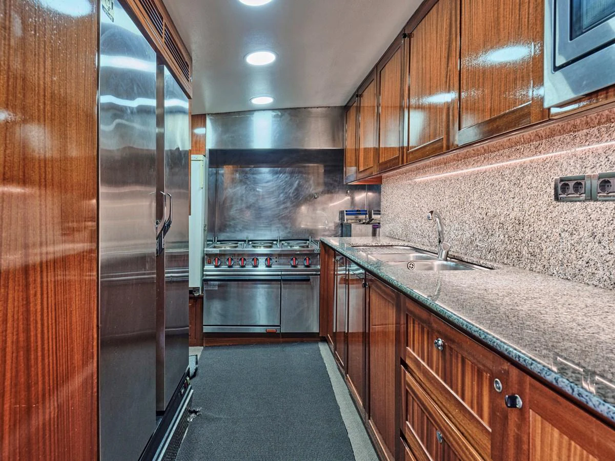 The yacht's galley features high-end appliances and ample counter space for gourmet meal preparation. aboard RESINA Yacht for Sale