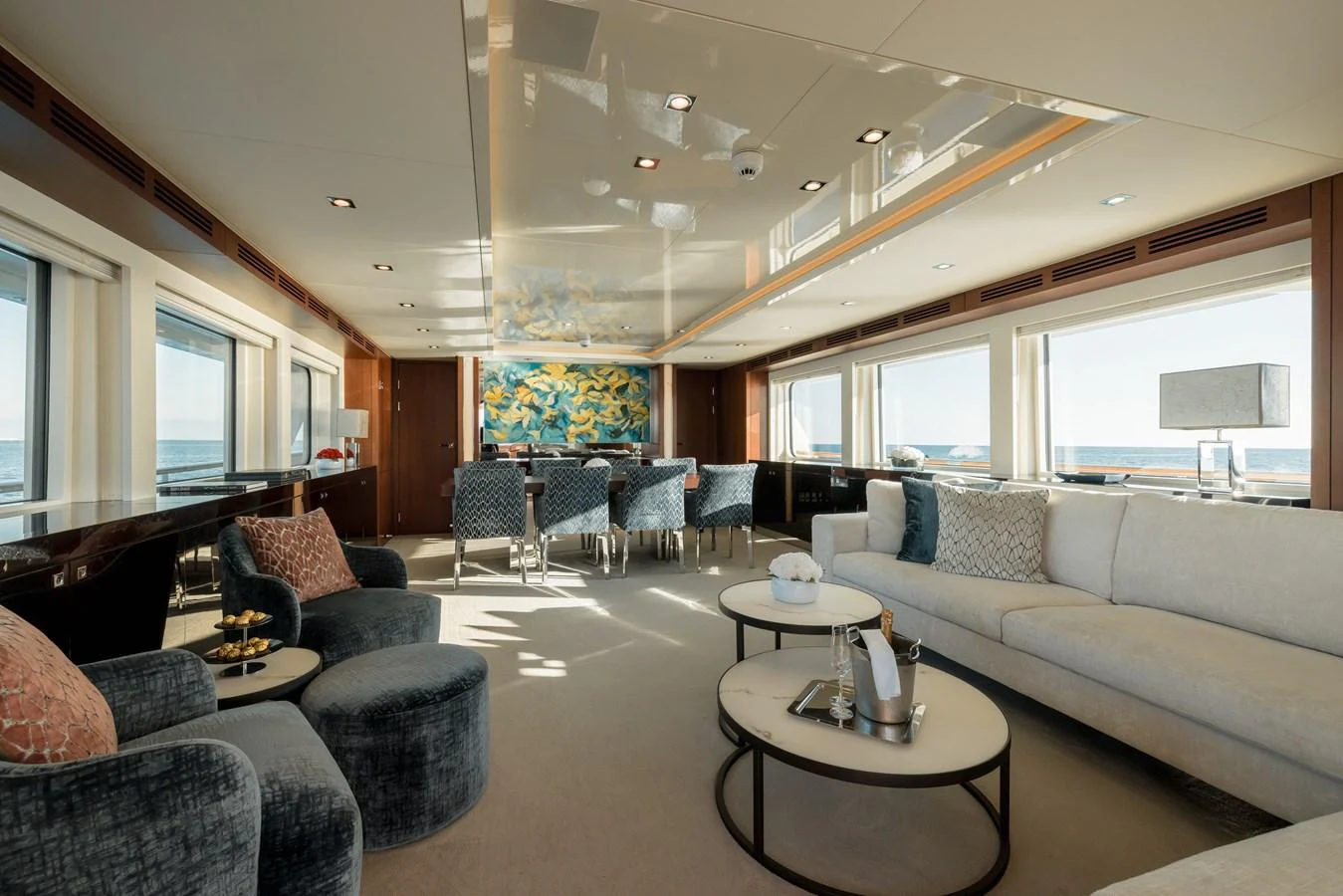 The spacious salon offers luxurious seating with panoramic ocean views. aboard ORIZZONTE Yacht for Sale