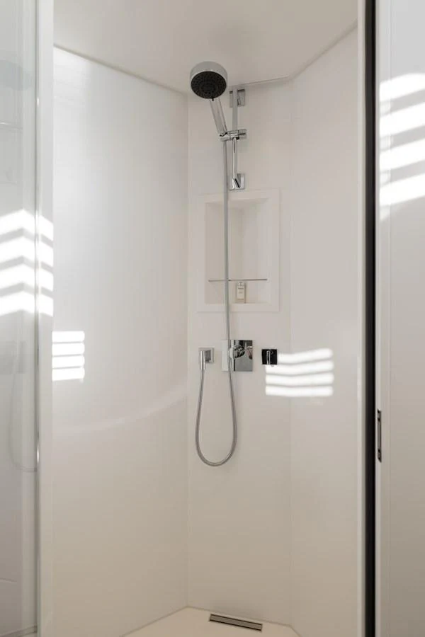 A sleek and modern shower area with minimalist design and high-end fixtures. aboard ORIZZONTE Yacht for Sale