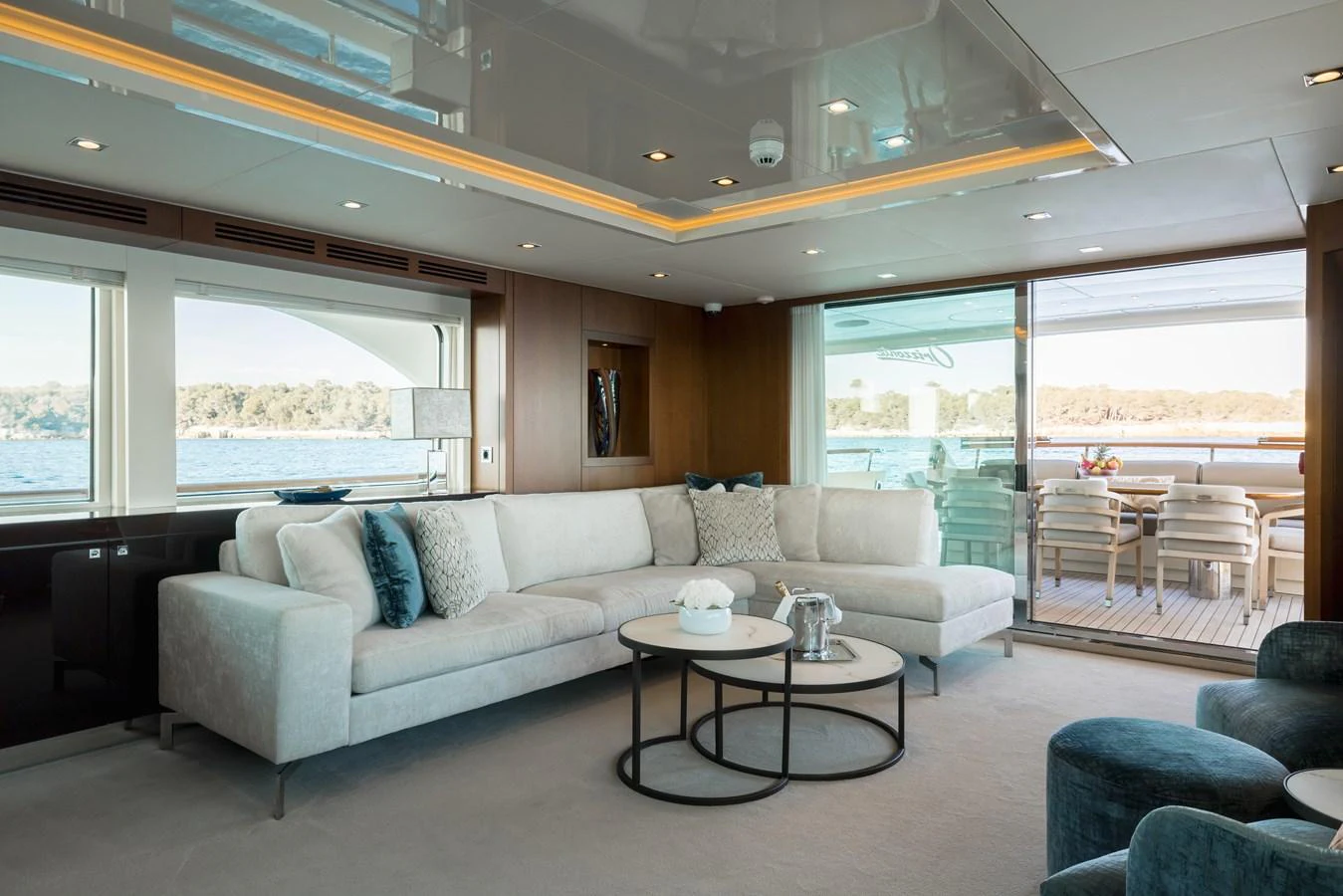 The yacht's salon features a spacious and elegant seating area with large windows offering stunning views. aboard ORIZZONTE Yacht for Sale