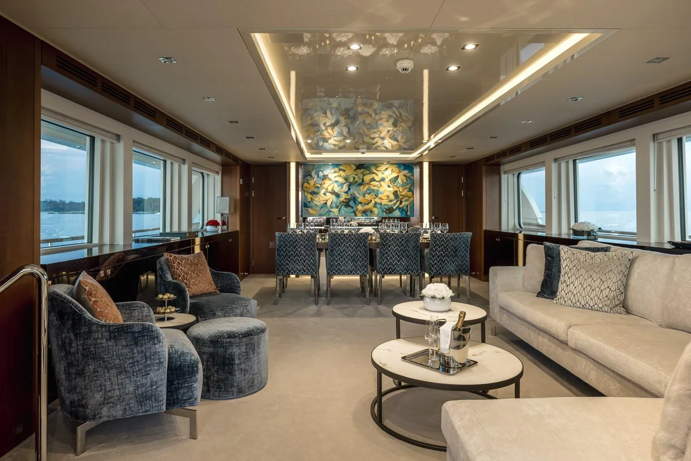 The salon features luxurious seating, elegant decor, and large windows offering stunning views. aboard ORIZZONTE Yacht for Sale
