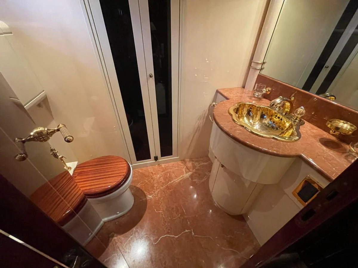 A luxurious yacht bathroom featuring a marble countertop and elegant fixtures. aboard MANGUSTA 72 Yacht for Sale