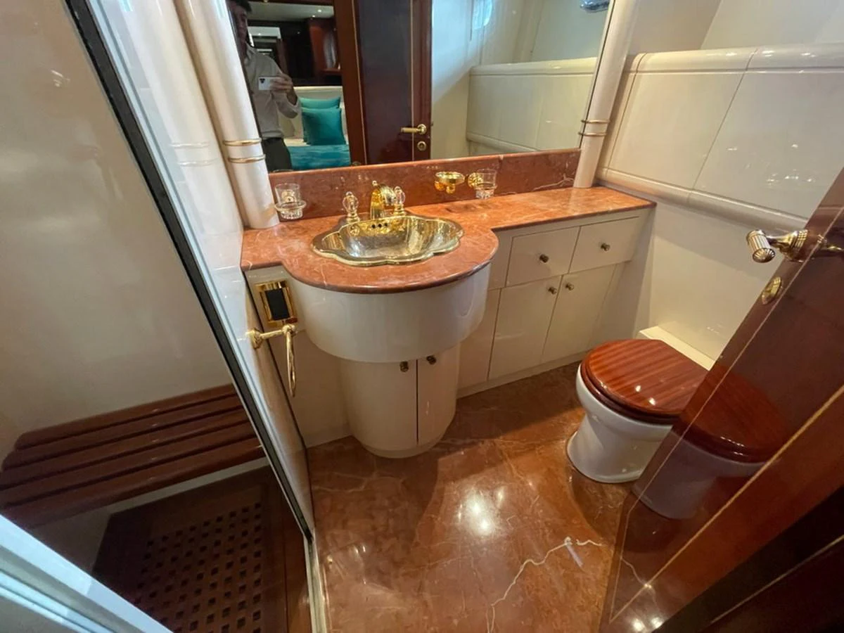 This image showcases a luxurious yacht bathroom with elegant fixtures and finishes. aboard MANGUSTA 72 Yacht for Sale