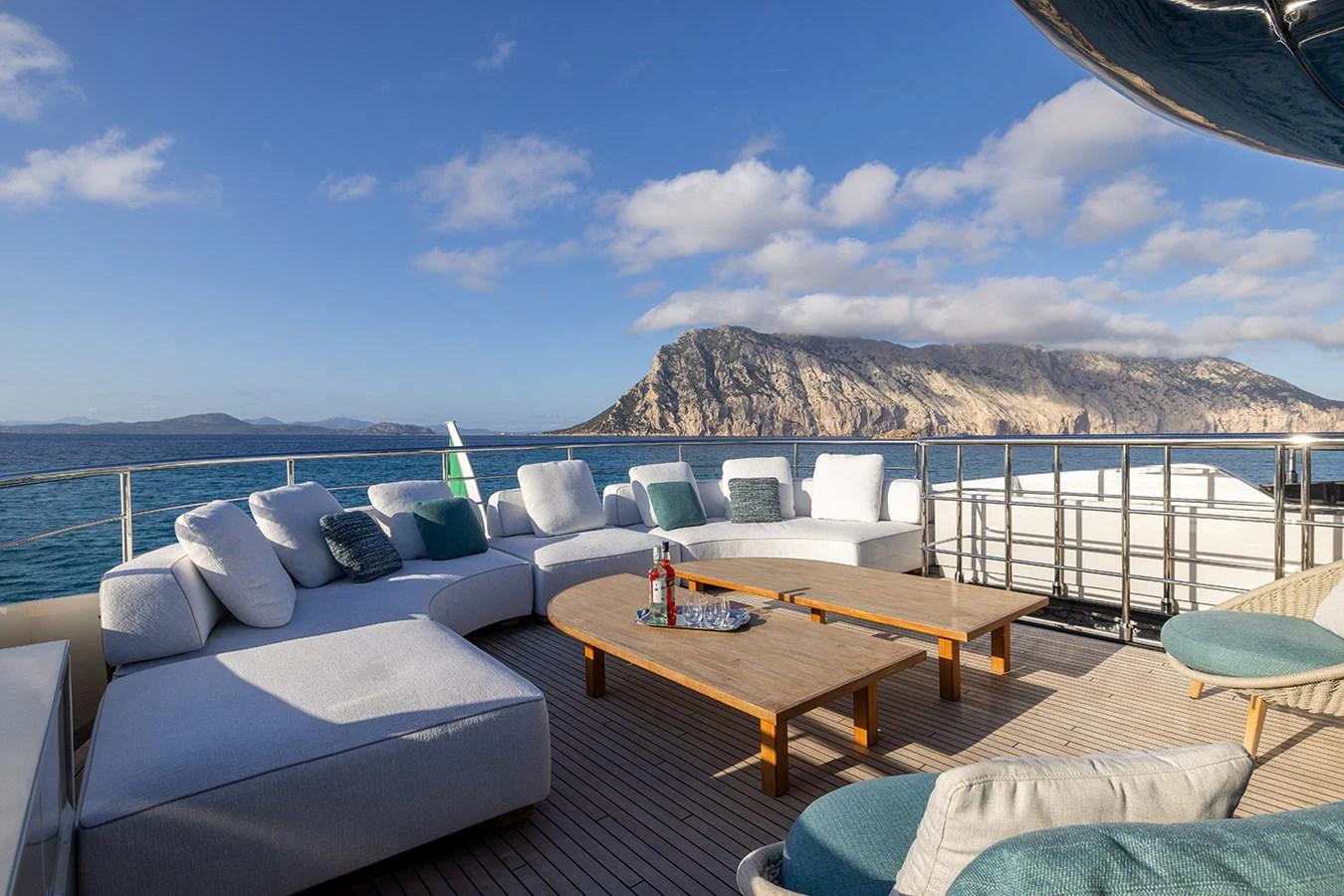 The aft deck features a spacious lounging area with comfortable seating and stunning ocean views. aboard MAI DIRE MAI Yacht for Sale