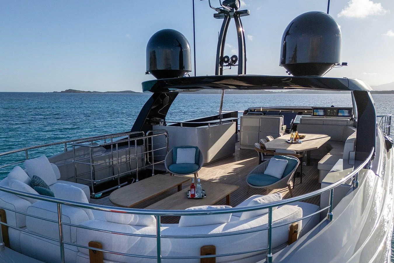 The flybridge offers a spacious and luxurious outdoor seating area with panoramic ocean views. aboard MAI DIRE MAI Yacht for Sale