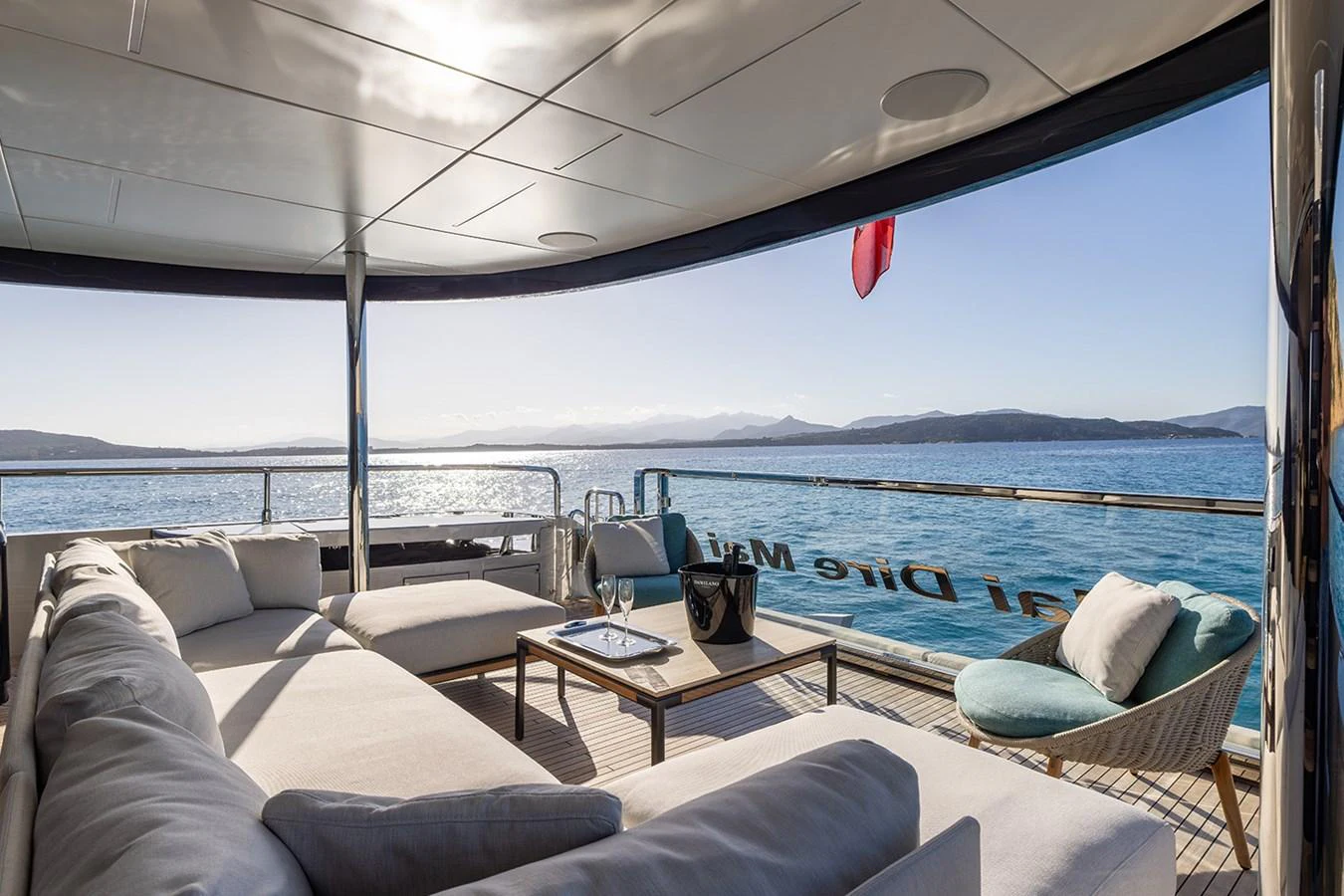 The aft deck offers a luxurious lounging area with stunning ocean views. aboard MAI DIRE MAI Yacht for Sale