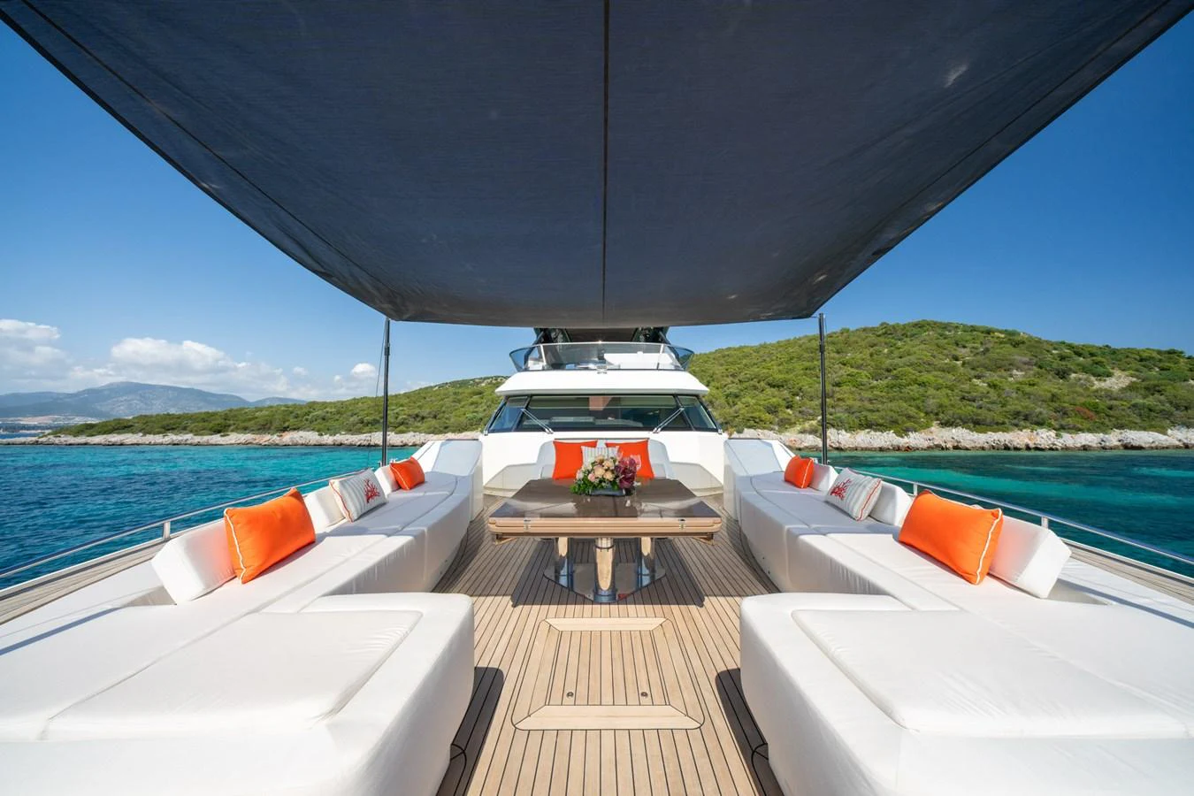 The sundeck offers a spacious and inviting area with comfortable seating and a shaded canopy, perfect for relaxation and socializing. aboard BELLA LUNA Yacht for Sale