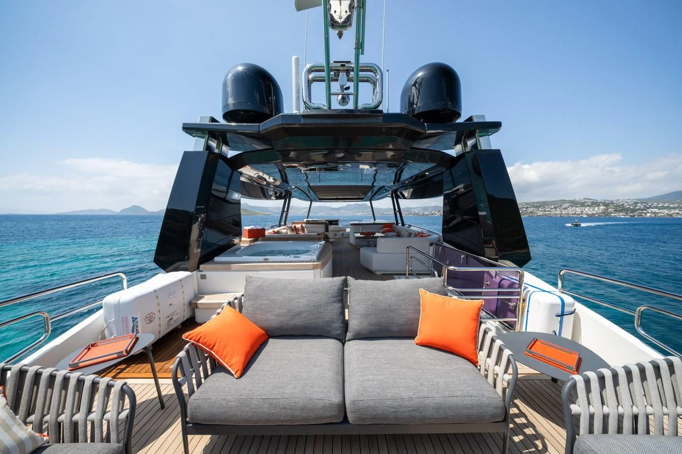The aft deck offers a luxurious lounging area with comfortable seating and stunning sea views. aboard BELLA LUNA Yacht for Sale