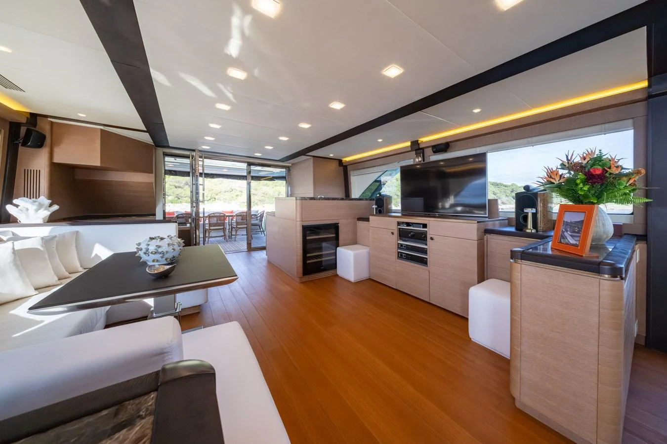The salon offers a spacious and modern living area with elegant furnishings and ample natural light. aboard BELLA LUNA Yacht for Sale