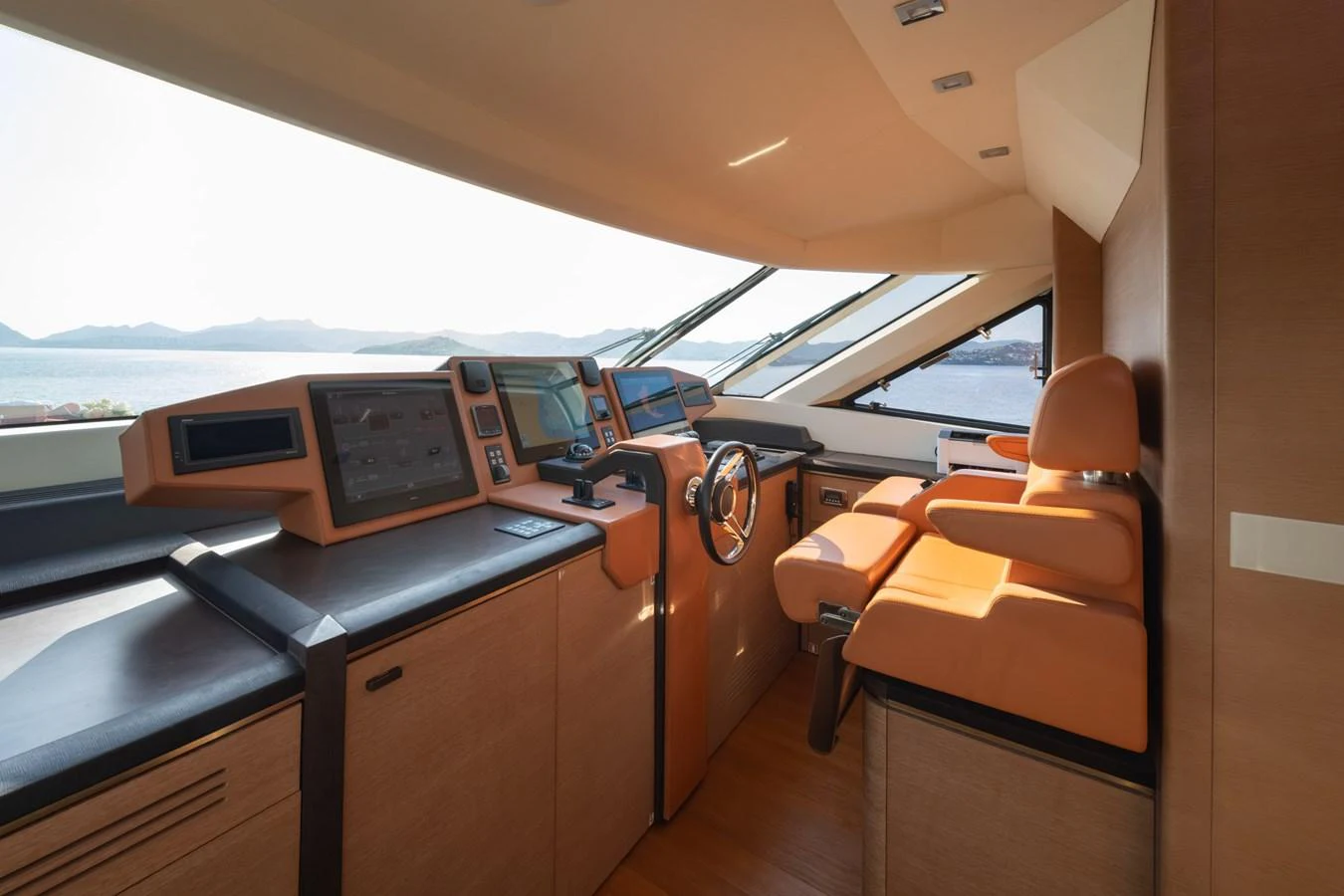 The helm station offers a commanding view with state-of-the-art navigation equipment and luxurious seating. aboard BELLA LUNA Yacht for Sale
