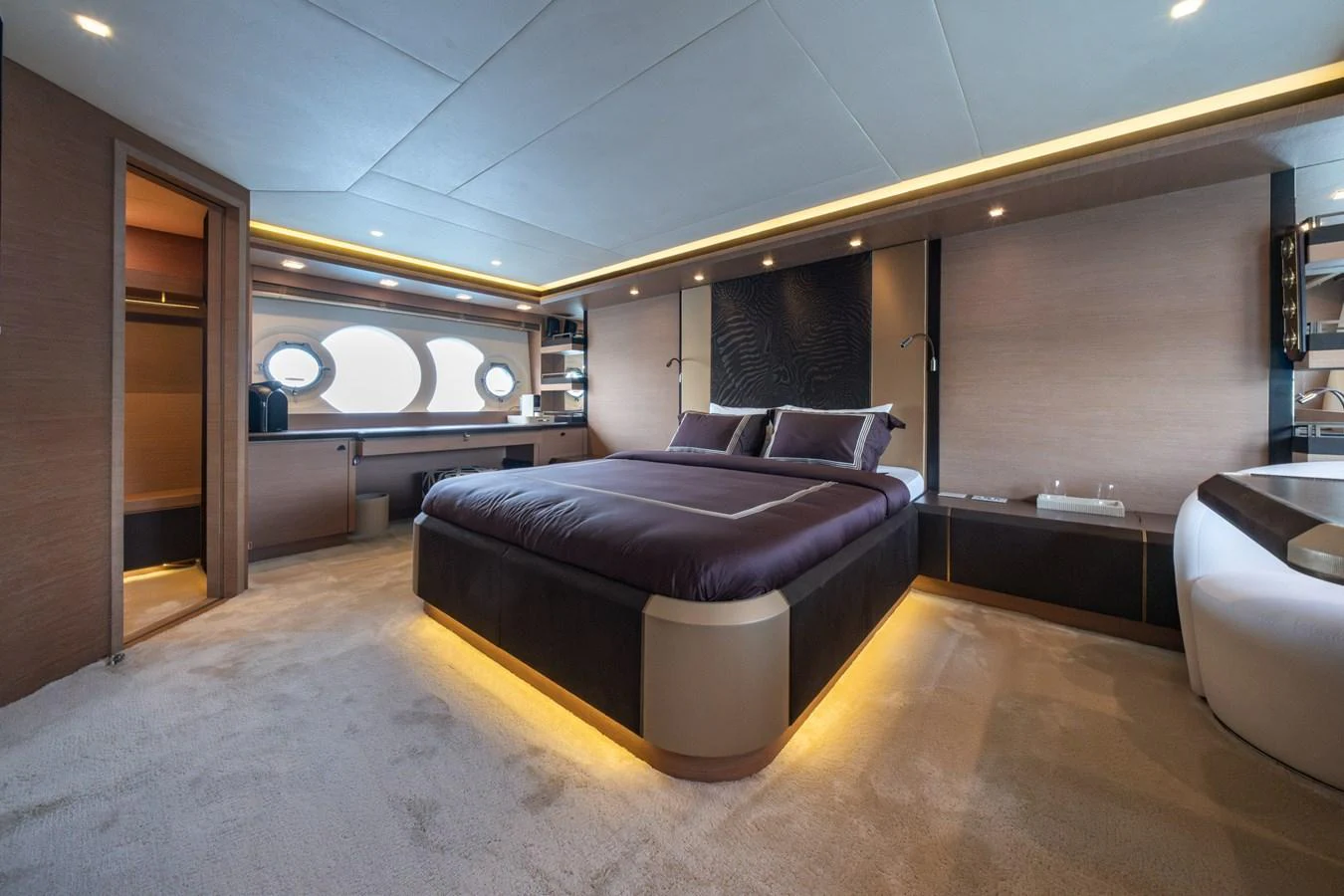 The master stateroom features a luxurious bed and modern furnishings. aboard BELLA LUNA Yacht for Sale