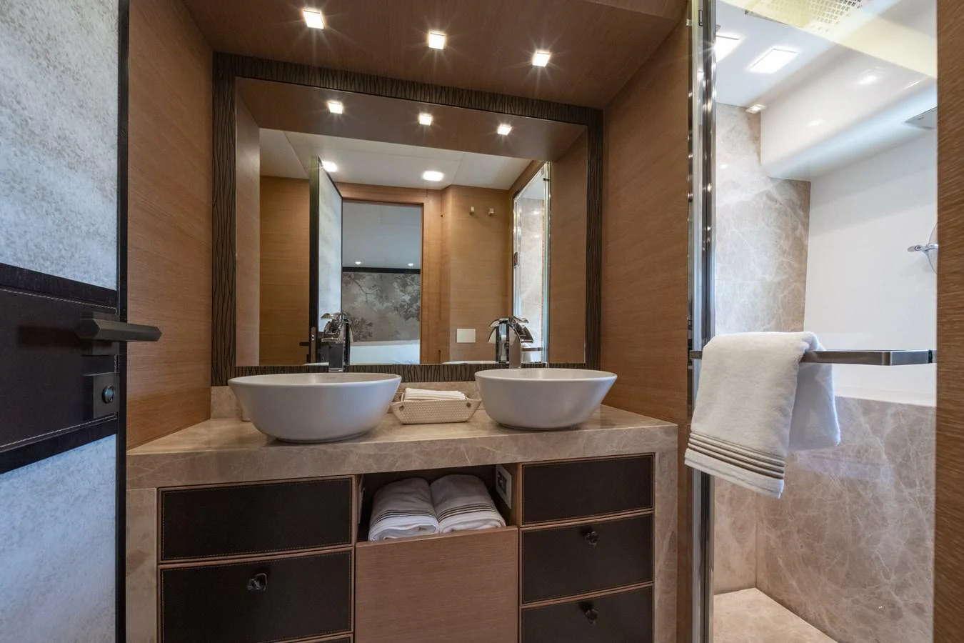 The yacht's bathroom features dual sinks and modern fixtures. aboard BELLA LUNA Yacht for Sale