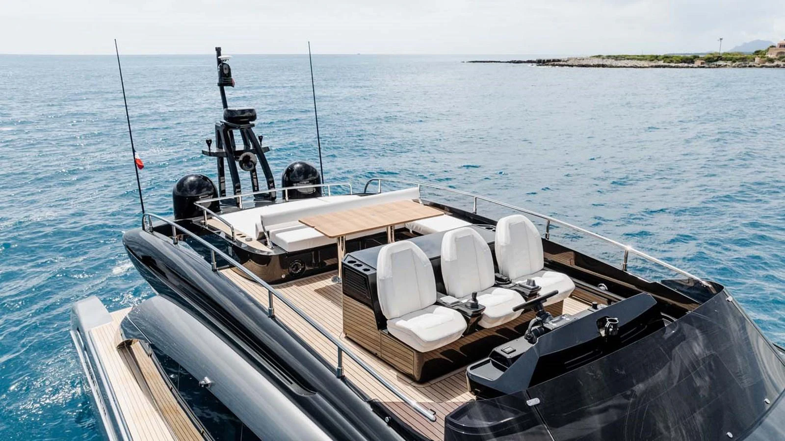 The yacht's flybridge offers a luxurious outdoor seating area with stunning views of the surrounding waters. aboard REEMA Yacht for Sale