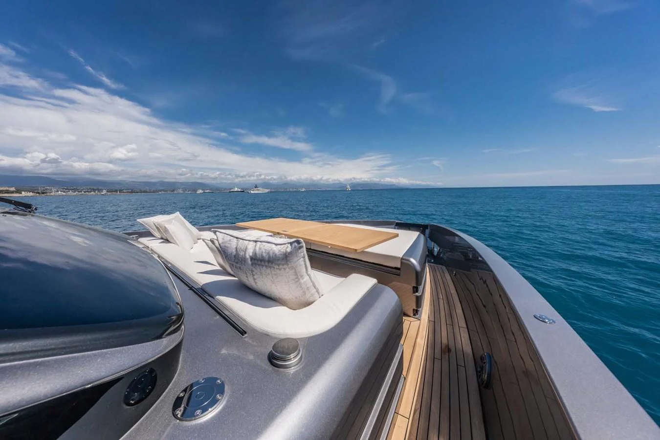 The foredeck of the yacht features luxurious sun pads and a stunning view of the open sea. aboard REEMA Yacht for Sale
