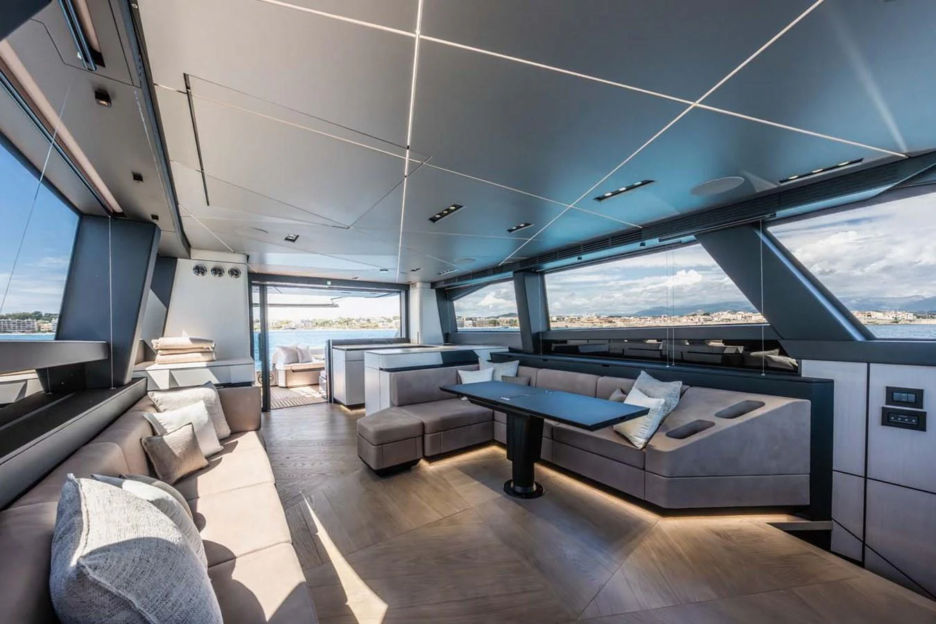 The spacious salon offers panoramic views and luxurious seating arrangements. aboard REEMA Yacht for Sale
