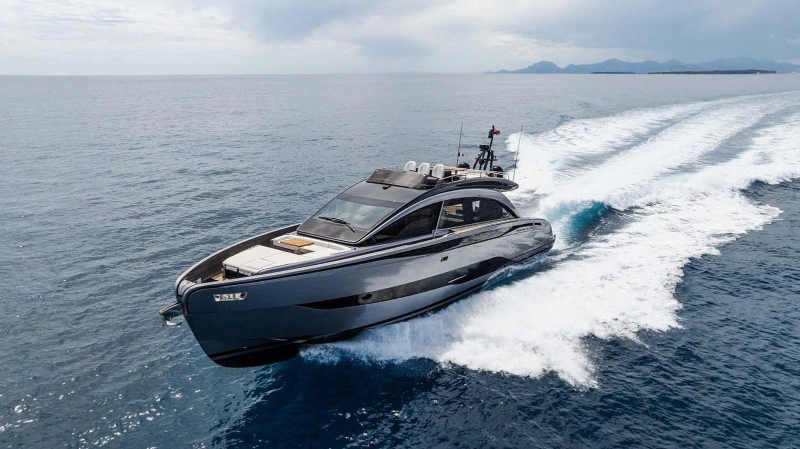 A sleek, modern yacht cruises swiftly across the open sea, showcasing its elegant design and powerful performance. aboard REEMA Yacht for Sale
