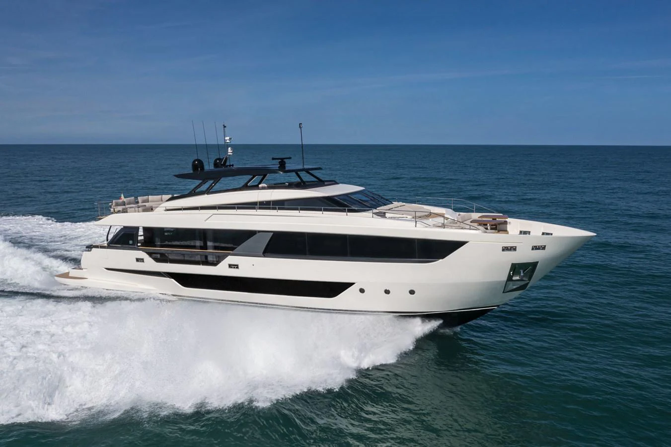 A sleek and modern yacht cruises swiftly on the open sea, showcasing its elegant design and powerful performance. aboard DANIMA Yacht for Sale