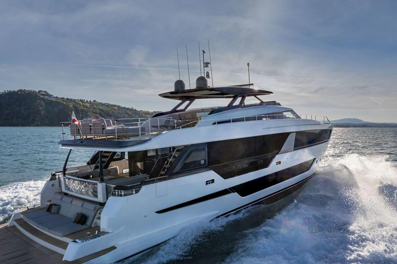 A sleek and modern yacht cruises through the water, showcasing its elegant design and spacious deck areas. aboard DANIMA Yacht for Sale