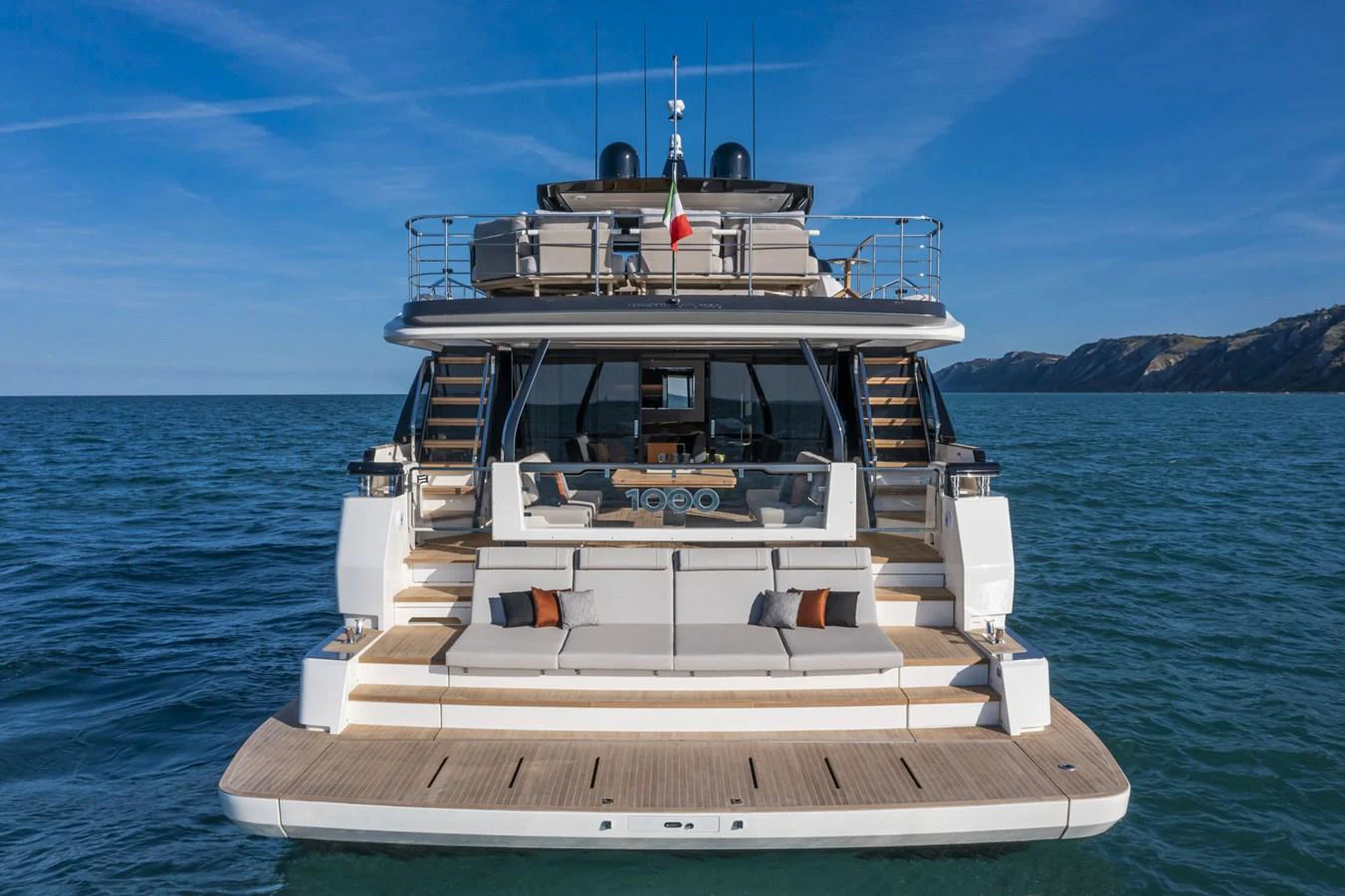 The yacht's stern showcases a spacious and inviting outdoor lounging area with elegant design. aboard DANIMA Yacht for Sale