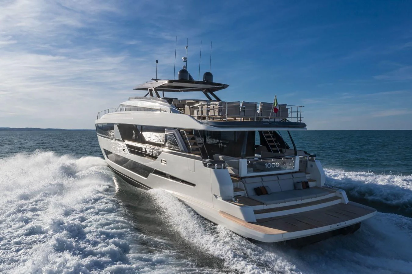 A sleek and modern yacht cruises through the open water, showcasing its impressive design and spacious deck. aboard DANIMA Yacht for Sale