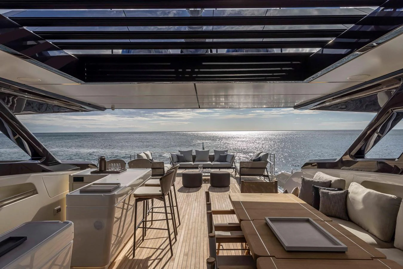 The aft deck offers a luxurious and spacious area for relaxation and dining with stunning ocean views. aboard DANIMA Yacht for Sale