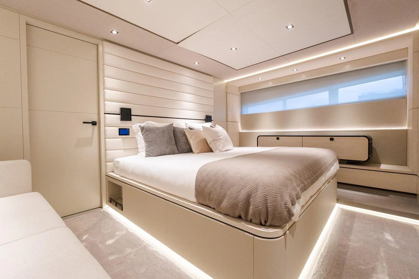 The master stateroom features a luxurious bed with modern lighting and elegant decor. aboard CASA BRI MARE Yacht for Sale