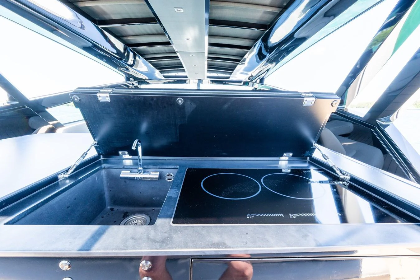 The yacht features a sleek and modern galley with a stovetop and sink, perfect for onboard culinary experiences. aboard CASA BRI MARE Yacht for Sale