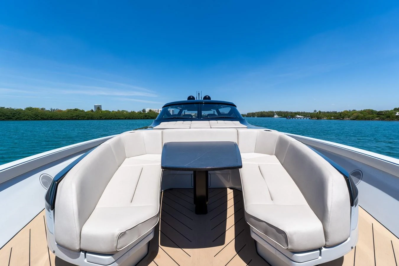 The yacht features a spacious and inviting bow seating area with a central table, perfect for relaxation and socializing. aboard CASA BRI MARE Yacht for Sale