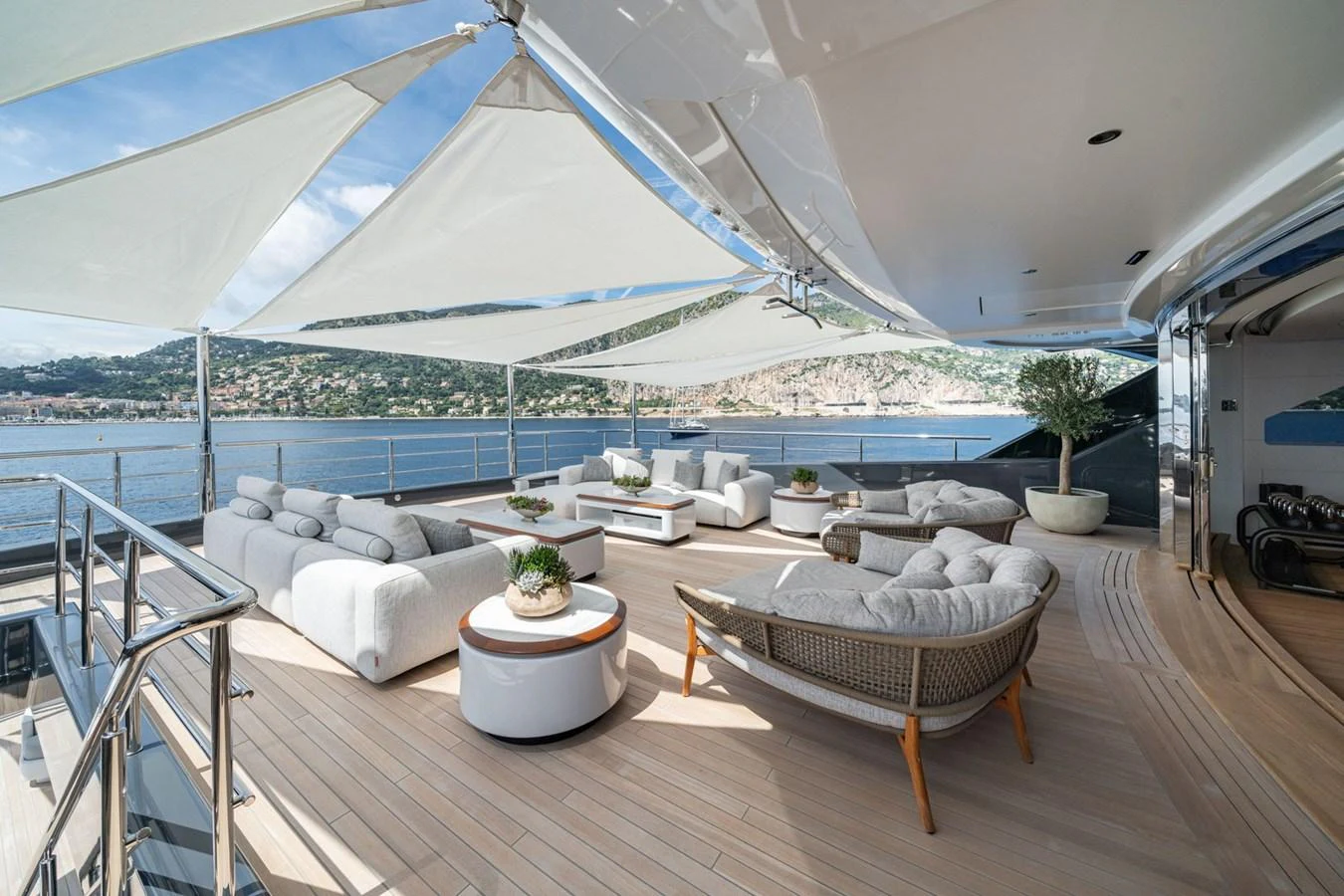 The sundeck offers a luxurious outdoor lounging area with comfortable seating and stunning views. aboard MALIA Yacht for Sale