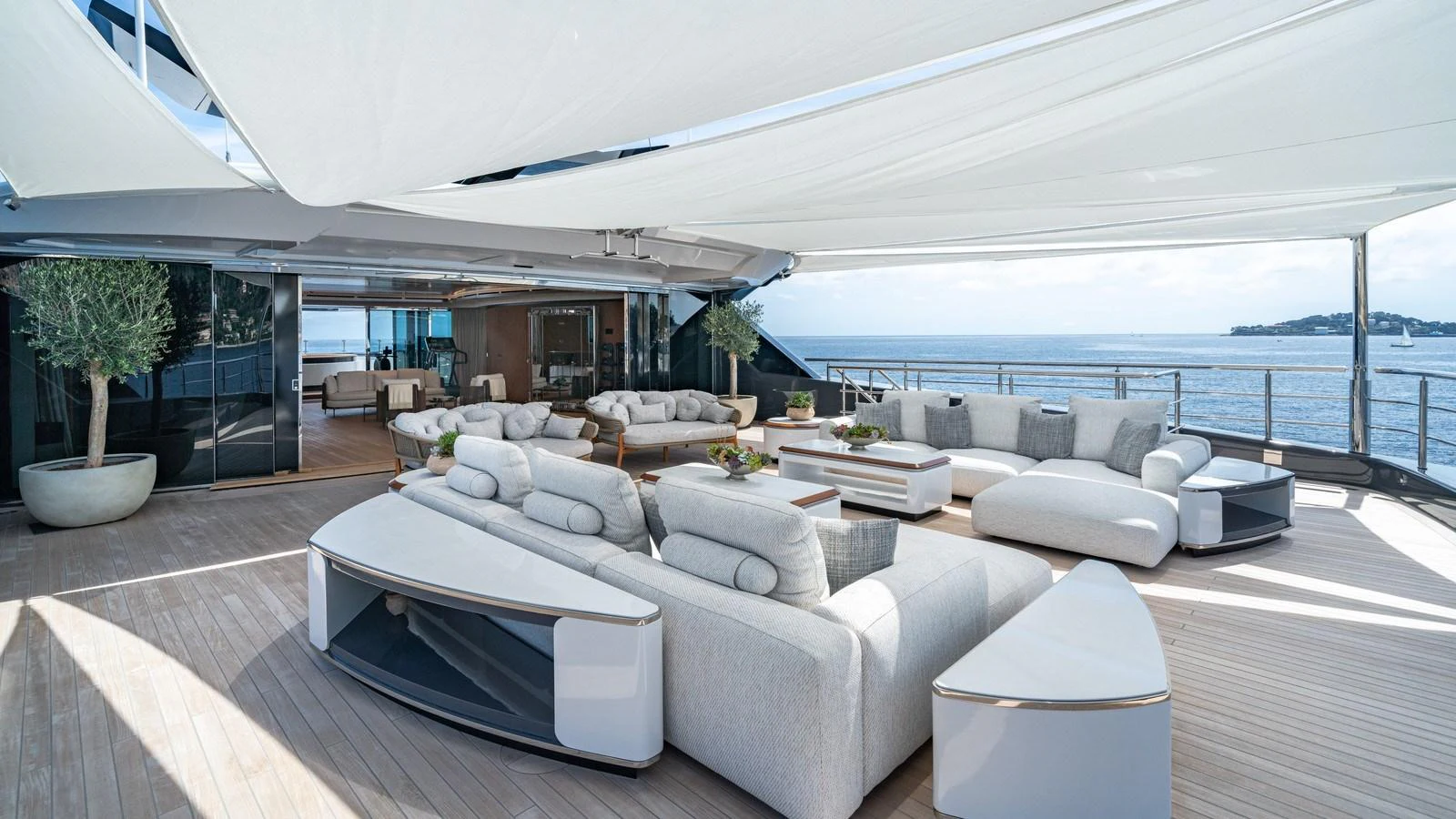 The spacious aft deck offers luxurious outdoor seating with stunning ocean views. aboard MALIA Yacht for Sale