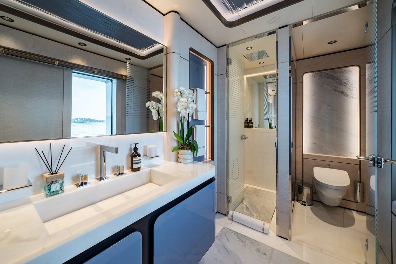 The yacht's bathroom features modern fixtures and a luxurious design with ample natural light. aboard MALIA Yacht for Sale