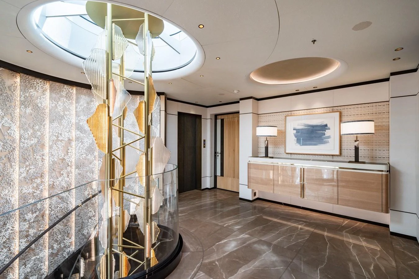 The yacht's interior features a stylish and modern foyer with elegant lighting and sophisticated decor. aboard MALIA Yacht for Sale