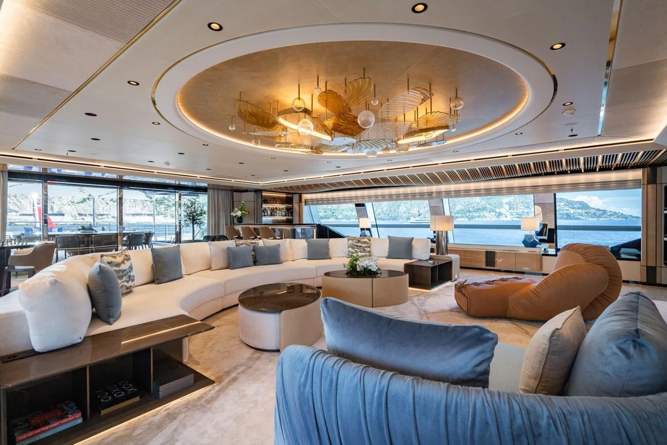 The spacious salon features luxurious seating and panoramic windows offering stunning views. aboard MALIA Yacht for Sale