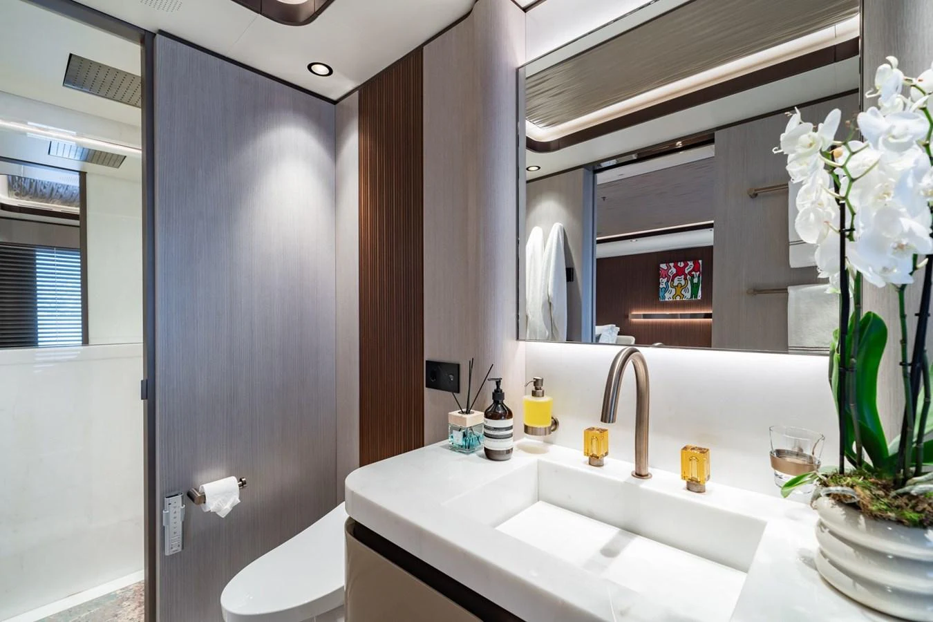 A modern yacht bathroom with elegant fixtures and a clean design. aboard MALIA Yacht for Sale