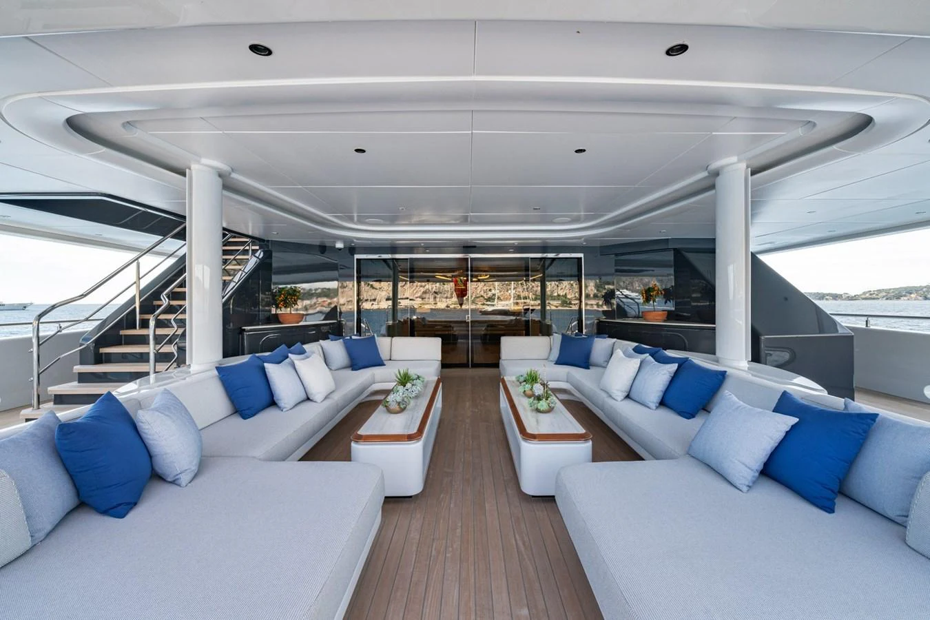 The aft deck features spacious seating with plush cushions and elegant decor, perfect for relaxation and socializing. aboard MALIA Yacht for Sale