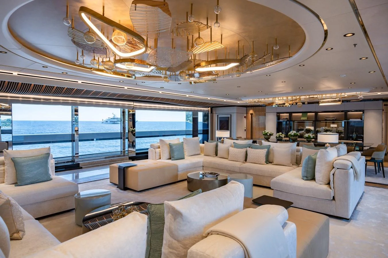 The spacious salon features luxurious seating with panoramic ocean views. aboard MALIA Yacht for Sale